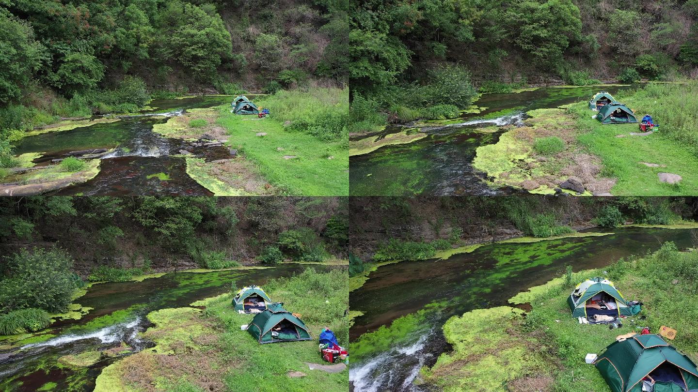 山间溪水旁帐篷露营
