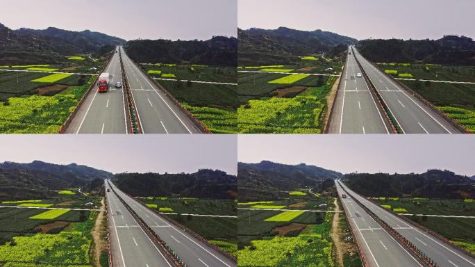 4K航拍高速公路穿过油菜花田