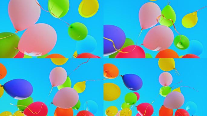 五颜六色的气球漂浮在蓝天上