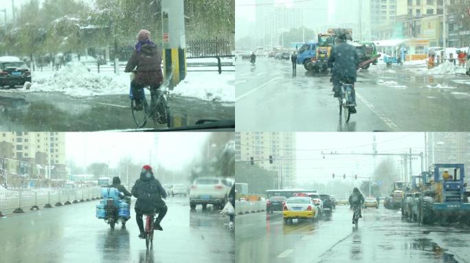 下雪天骑自行车老人骑车雪地骑车冬天骑电动
