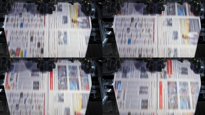 印刷厂正在剪报的单张报纸