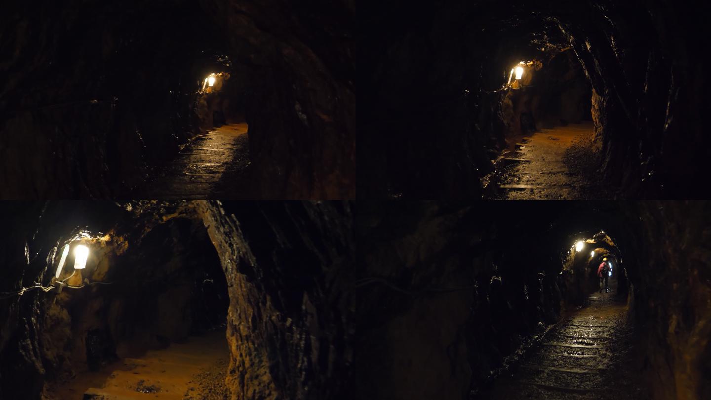 在黑暗的隧道里，一个女人正朝出口走去
