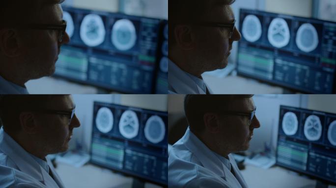 专业医生在电脑显示器上查看CT扫描图像