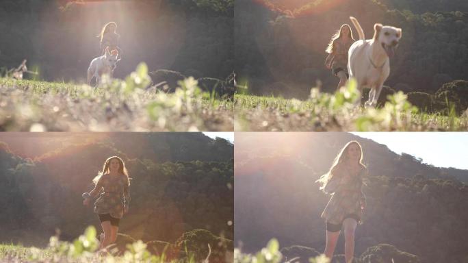 年轻女子和她的狗在大自然中奔跑