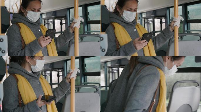 戴着防护面罩的妇女正在使用电话并下车。