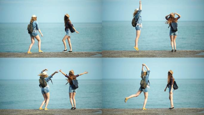年轻女子在海边嬉戏跳舞。
