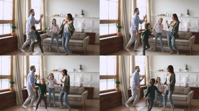 父母和孩子在客厅里跳舞跳跃