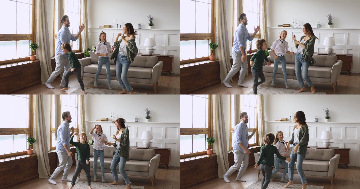 父母和孩子在客厅里跳舞跳跃