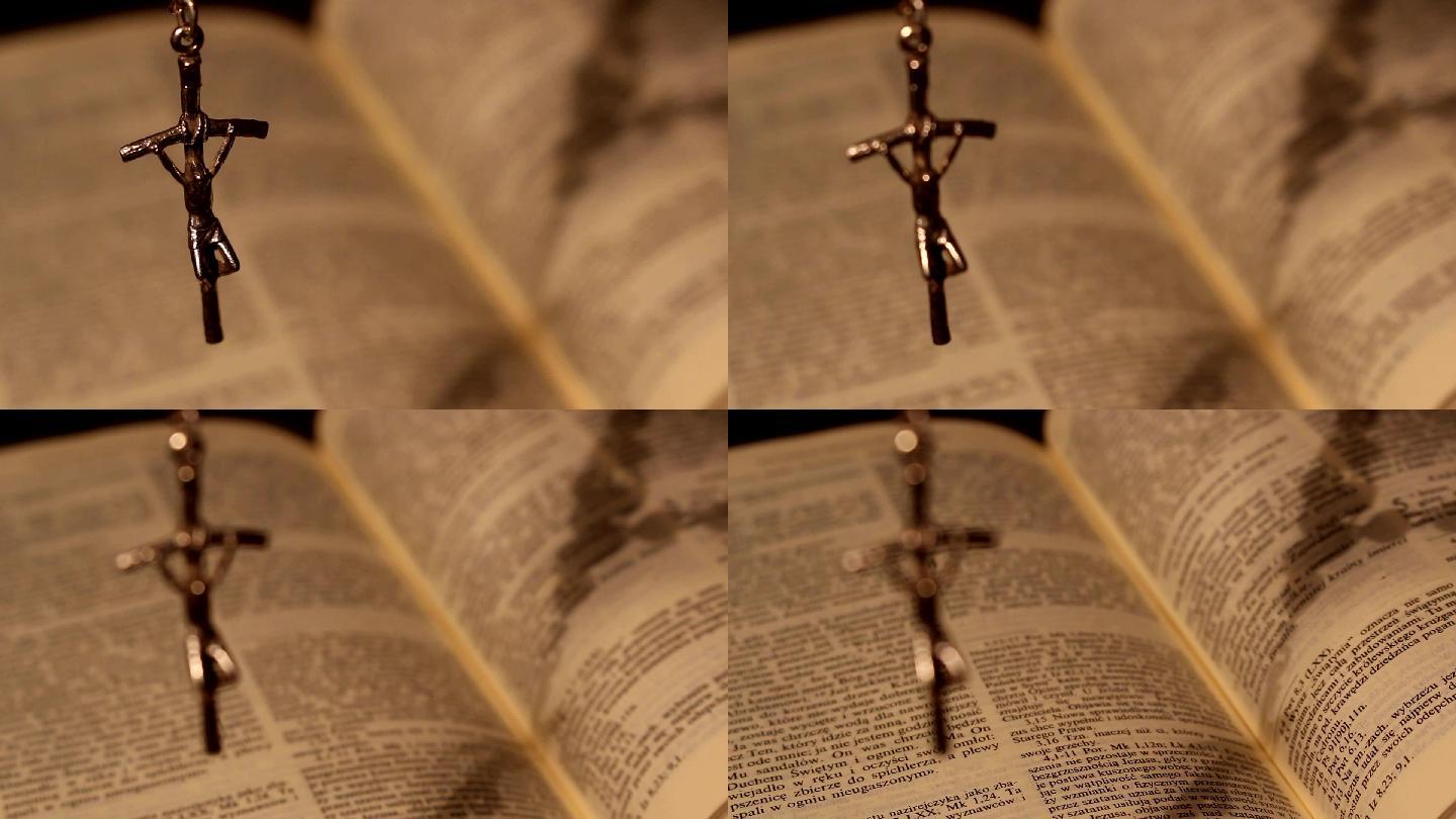 念珠，十字架挂在打开的圣经上