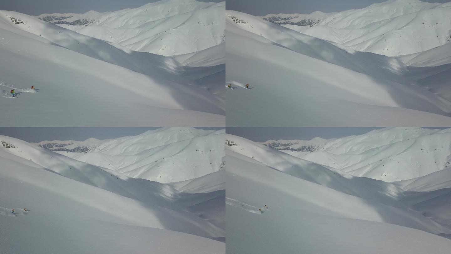 滑雪者从雪山下降的鸟瞰图