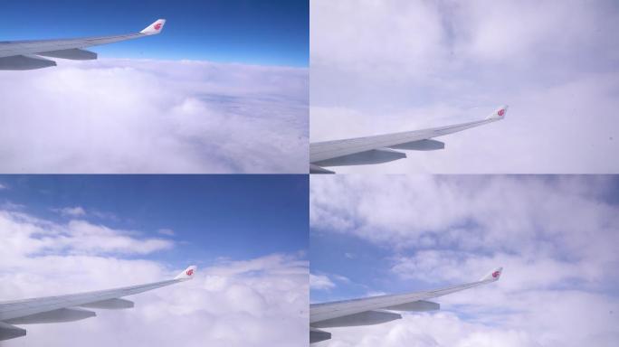 飞机窗外的高空窗外机翼天空云层美景
