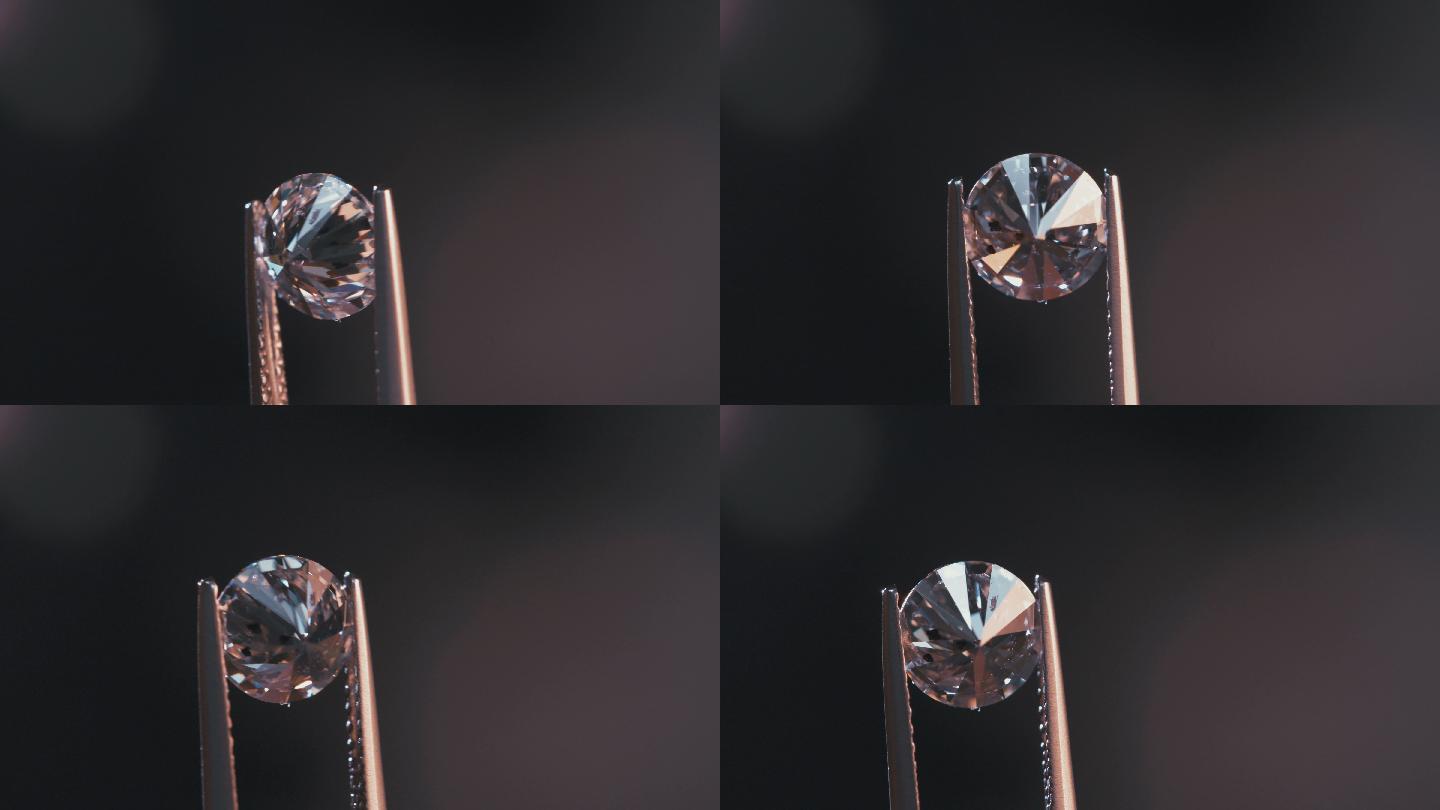 一位宝石学家正在检查一颗大而透明的钻石