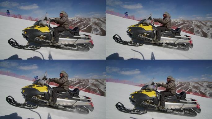 外国游客在滑雪场驾驶摩托雪橇快速速行驶