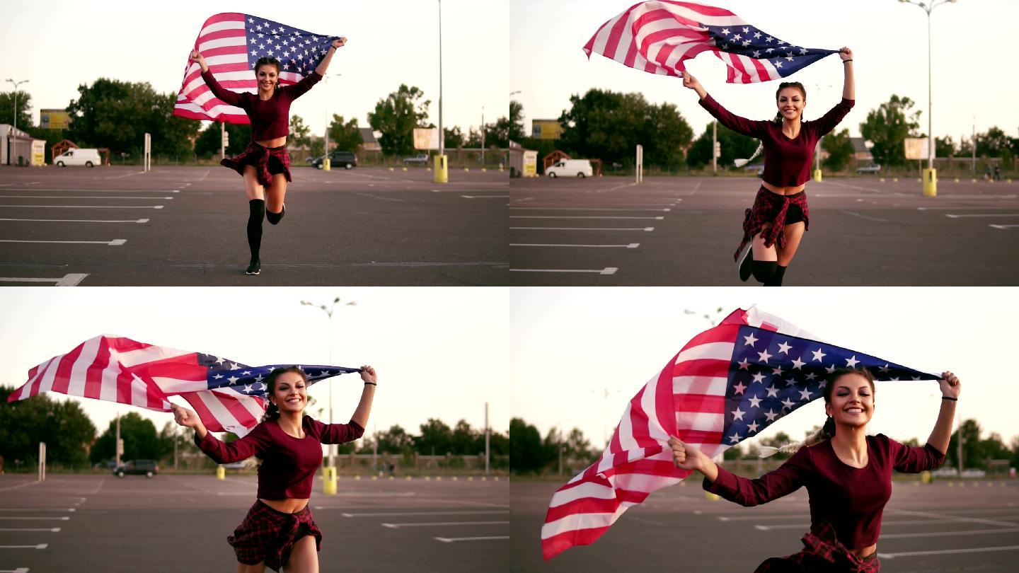 女孩举着美国国旗一边看着镜头一边跑步