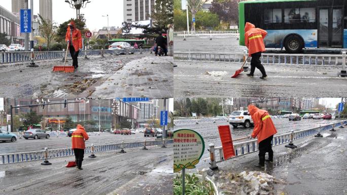 清洁工雨夹雪天气清理积雪