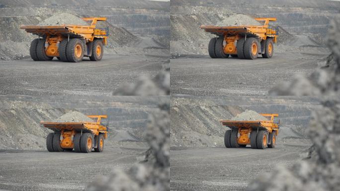 自卸车在装载矿石的采石场道路上行驶