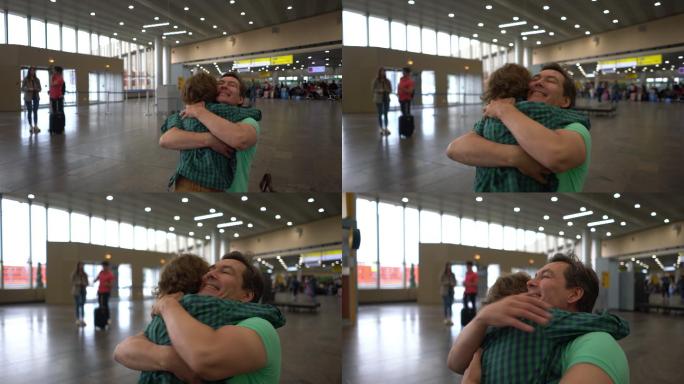 兴奋的小男孩在机场接他的父亲