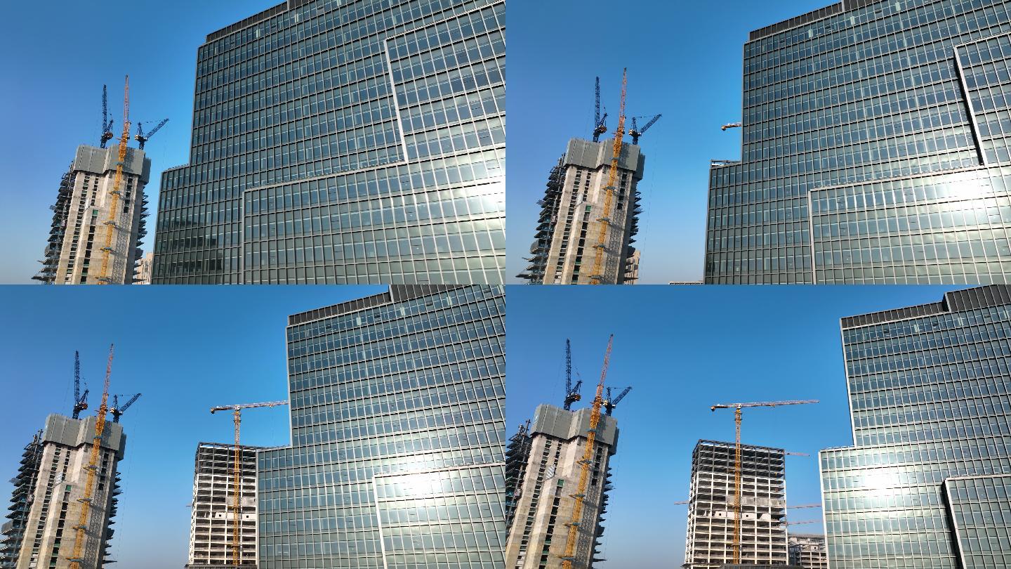 航拍建造中的高楼与已建成的商务楼