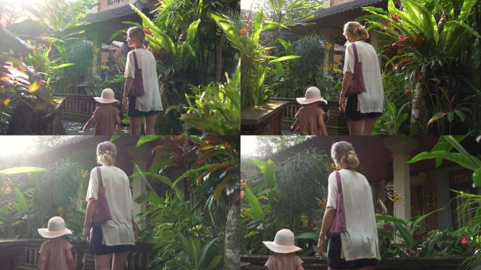 一位母亲和一个可爱的女儿正在植物园参观