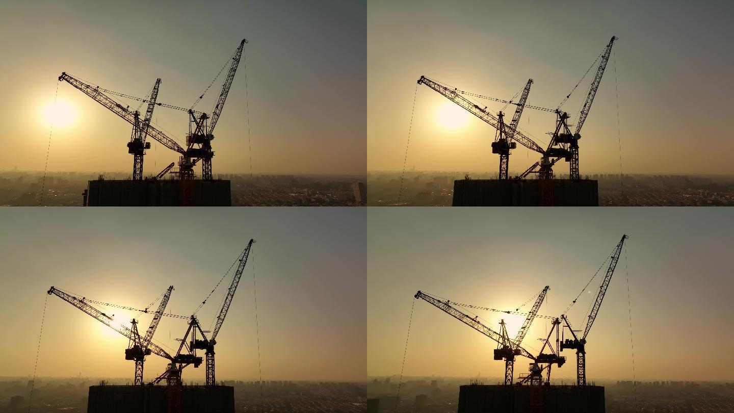 夕阳下航拍建筑工地塔吊