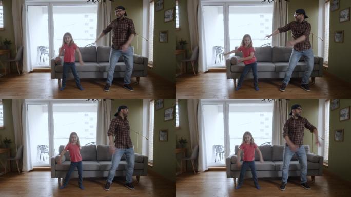 父亲和女儿在家客厅跳舞