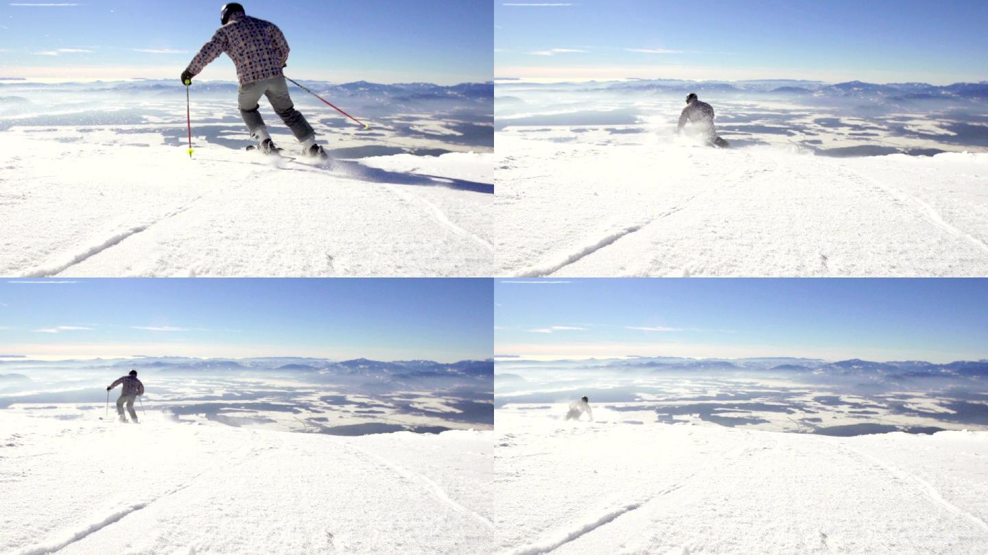 后视图滑雪者滑雪下雪坡