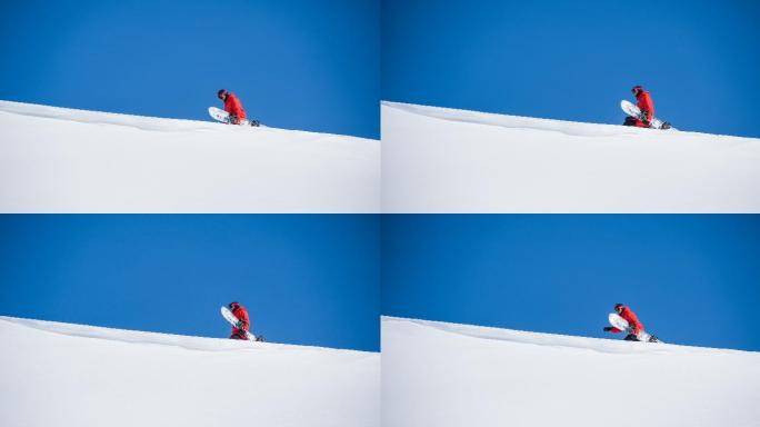 年轻人拿着滑雪板行走在雪原的风景
