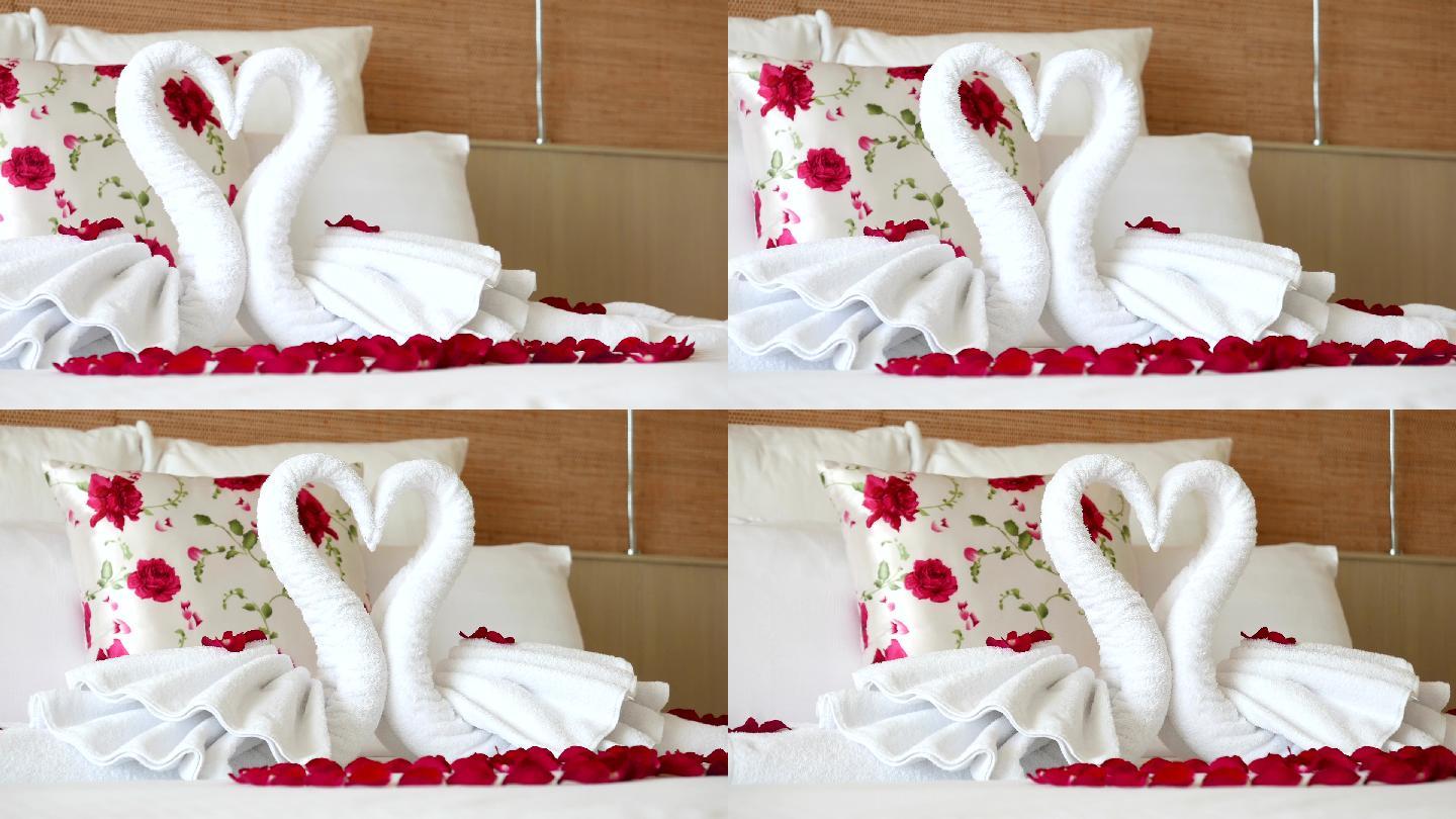 带毛巾和玫瑰的浪漫卧室设置