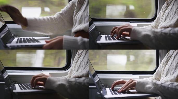 在列车上使用笔记本电脑的人