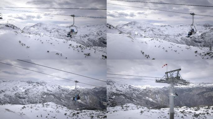 从空中拍摄的滑雪者乘坐缆车
