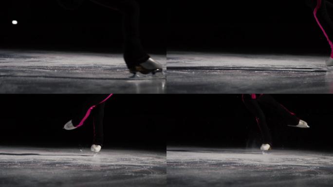 特写镜头，穿着冰鞋的双腿在冰上跳起并落地。