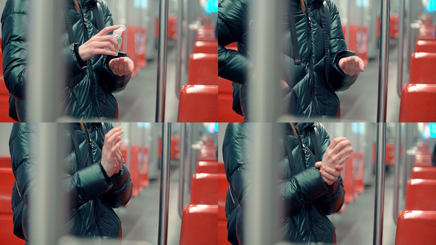 一名女子在地铁车厢内使用洗手液
