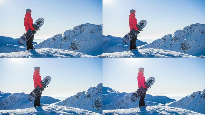 滑雪者站在雪山的顶部看风景