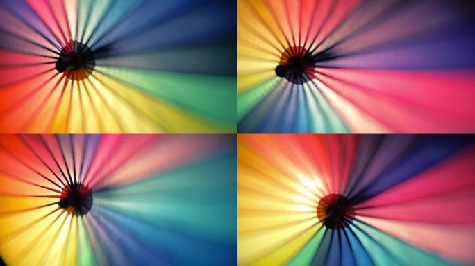 旋转彩虹伞的彩色特写镜头。