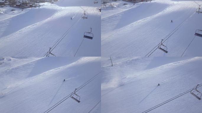 滑雪胜地雪山上滑雪的男子鸟瞰图
