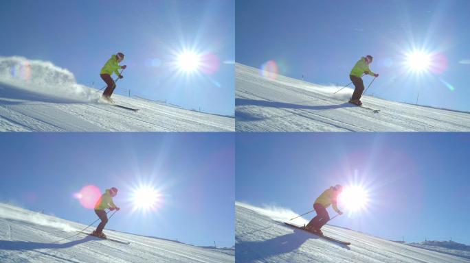 滑雪者在阳光下滑雪