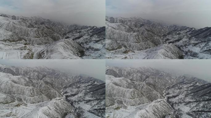 航拍山西山间雪景行车雪后大山