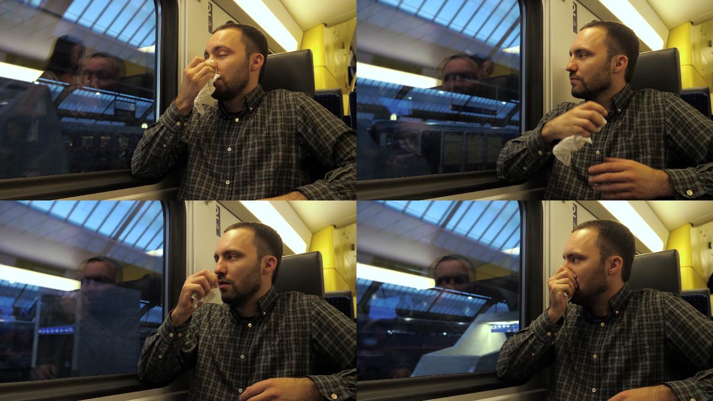 成熟男子在火车上咳嗽