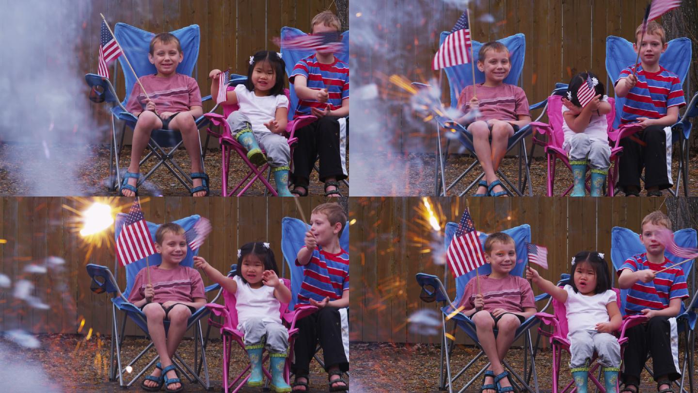 三个孩子在看烟火庆祝7月4日