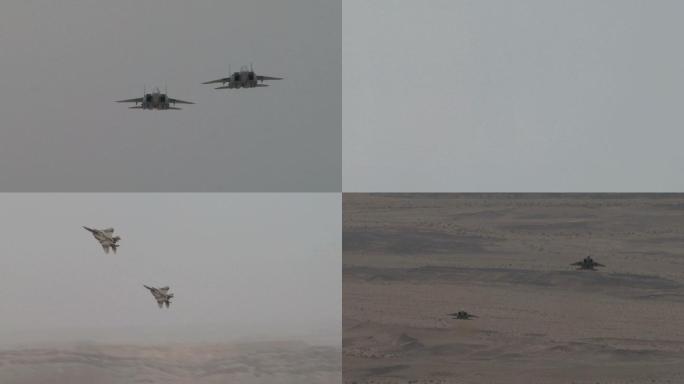 2架猎鹰F-15战斗机在沙漠地面上空飞行