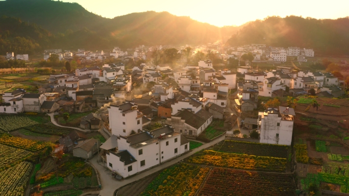 航拍皖南徽州夕阳下古村落炊烟秋色