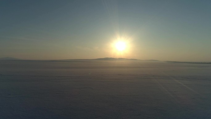 冬季夕阳黄昏广阔雪地空镜