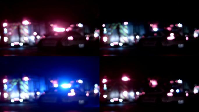 救护车、警察和消防车在夜间模糊灯光
