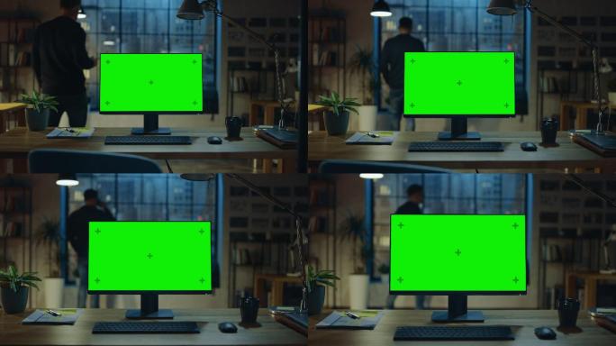 办公桌上放着一台带有模拟绿色屏幕的台式电