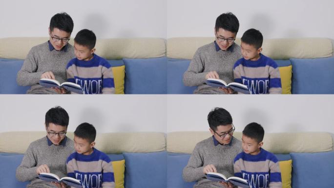 4K父亲在客厅沙发上坐着陪儿子看书