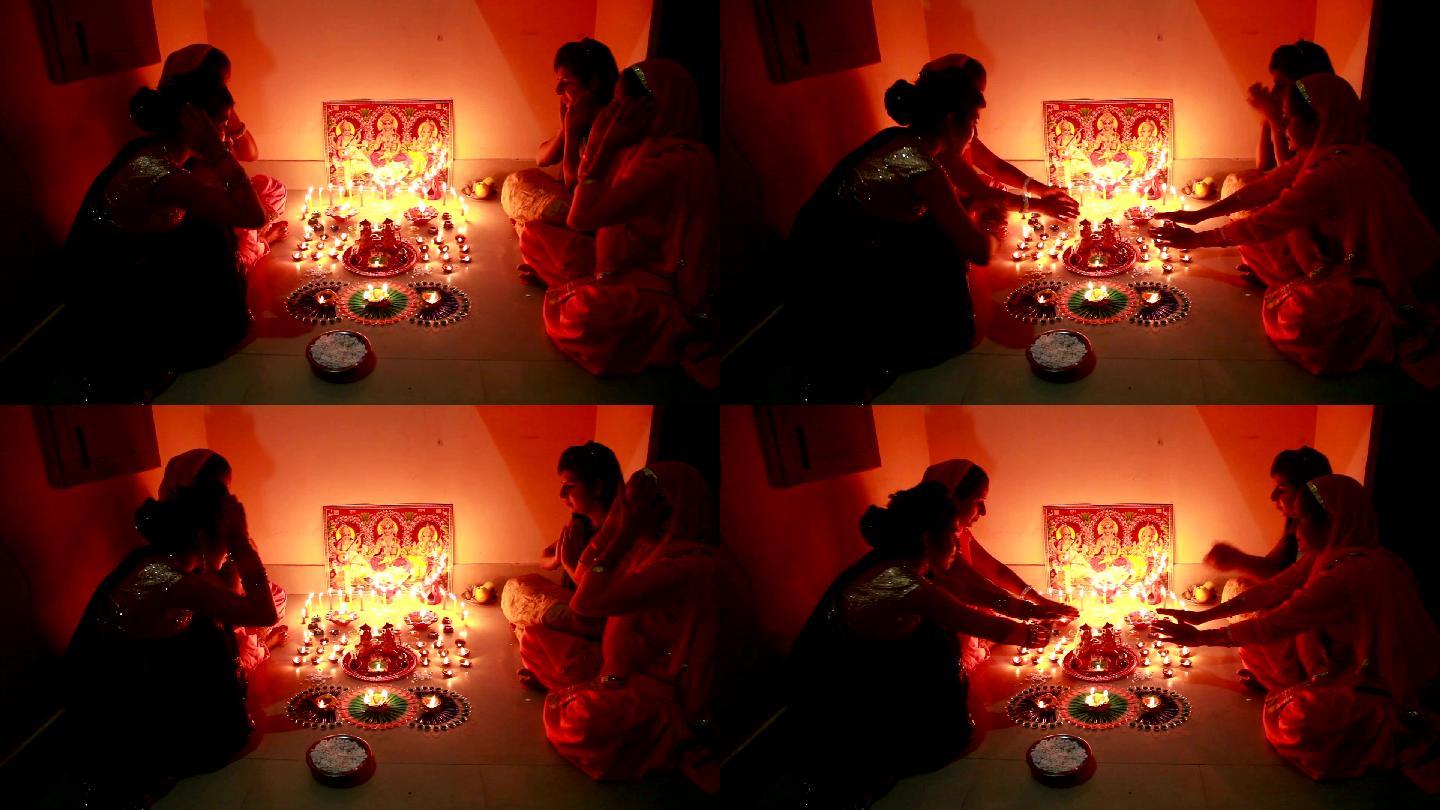 排灯节上，印度传统妇女在家敬拜
