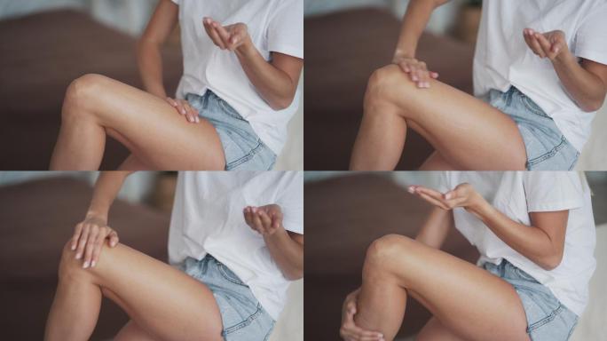 女性在腿上涂抹抗脂肪团霜