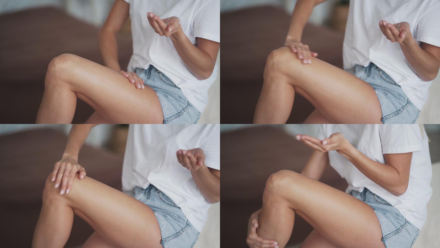 女性在腿上涂抹抗脂肪团霜
