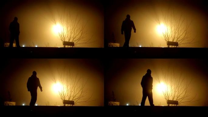一个人在雾蒙蒙的夜晚行走