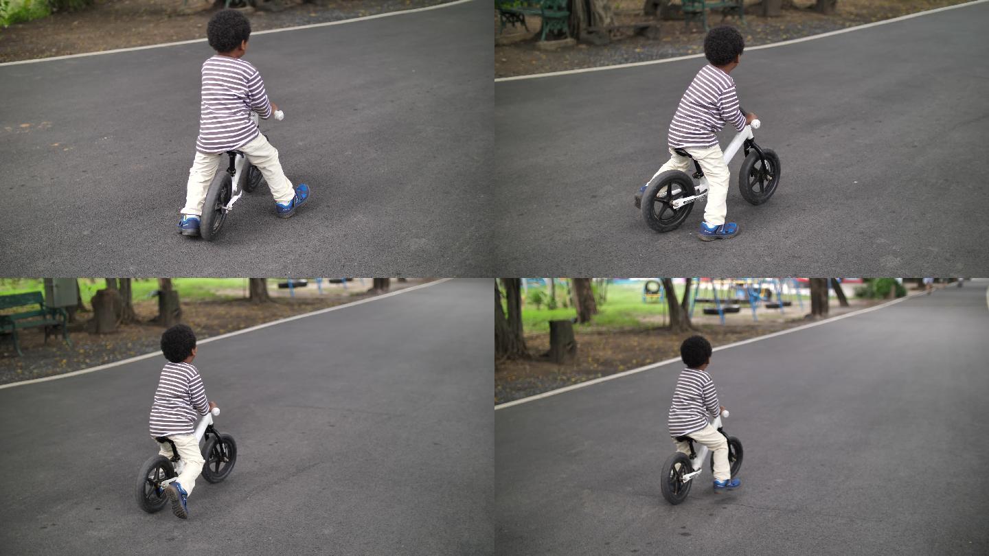 亚洲小男孩小孩玩自行车